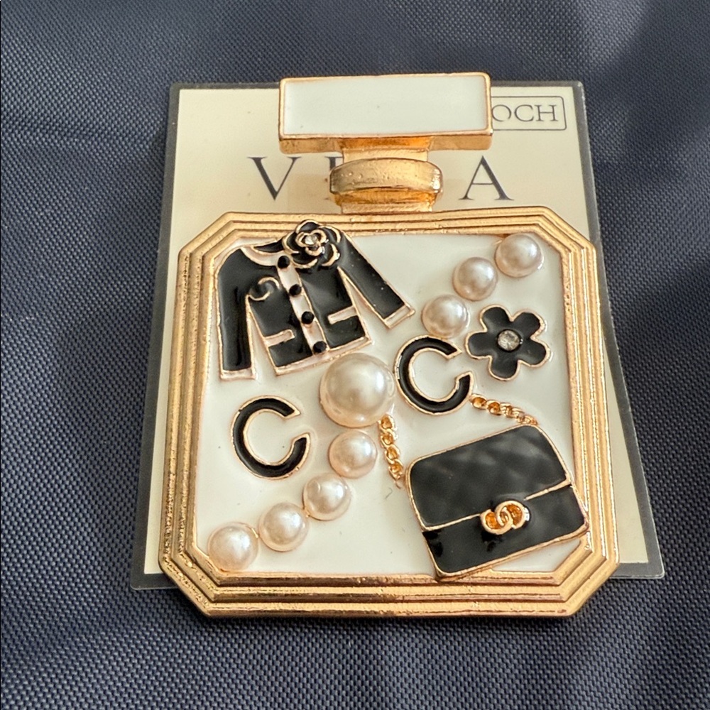Elegant Gold and Black Brooch